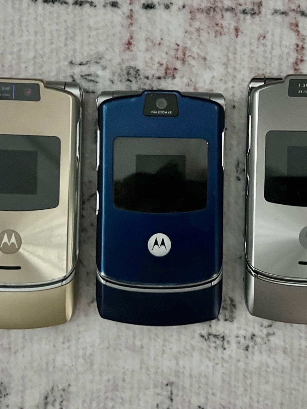 3 Vintage Motorola flip phones... with chargers.